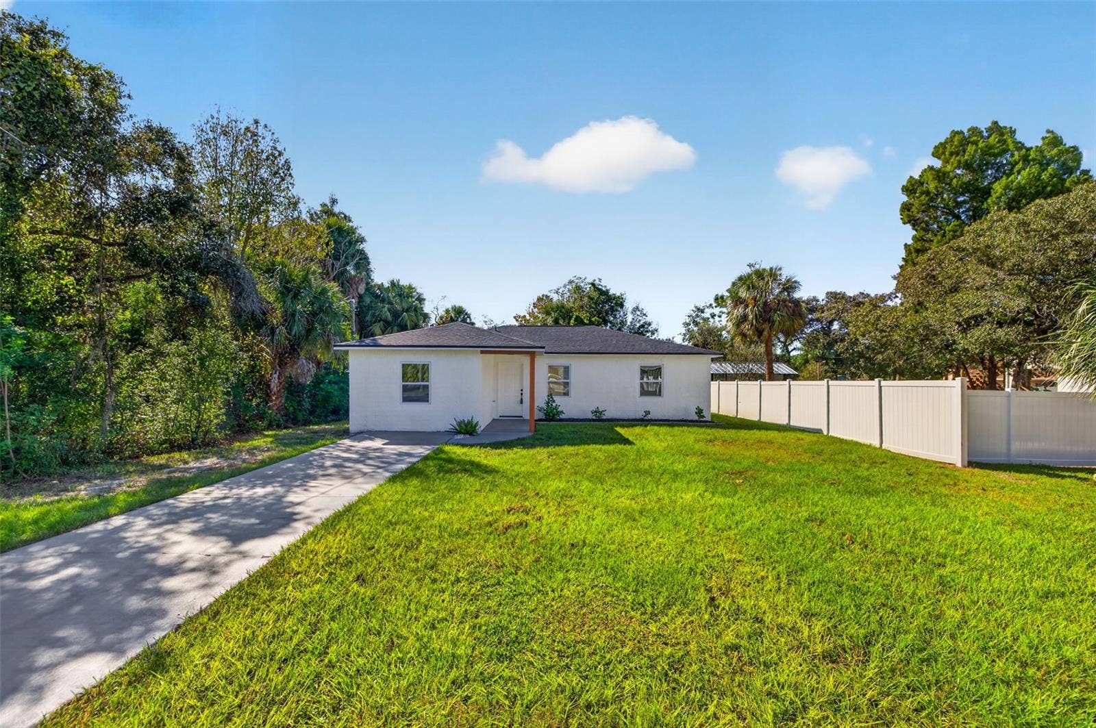 16107 SEA PINES DRIVE, Hudson, FL 34667 Extended driveway offers parking for up to four vehicles.
