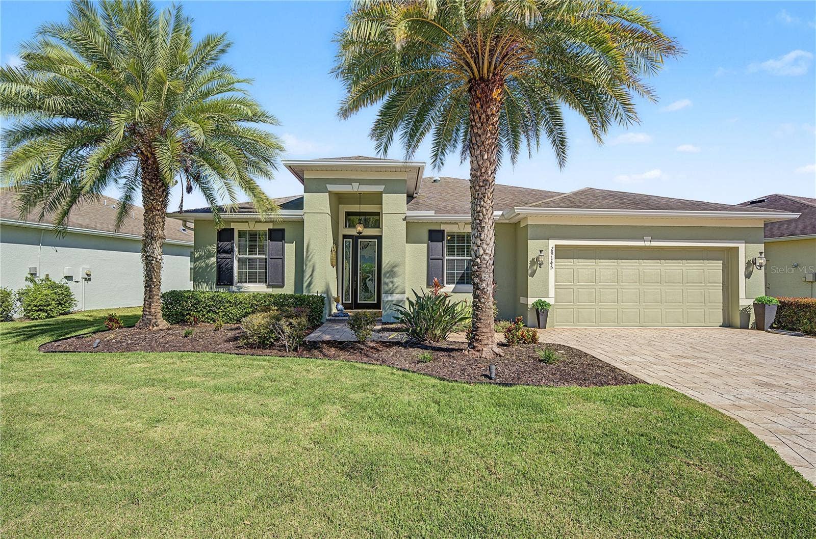 29145 GRASS BUNKER DRIVE, San Antonio, FL 33576 Tropical landscape adds to curb appeal