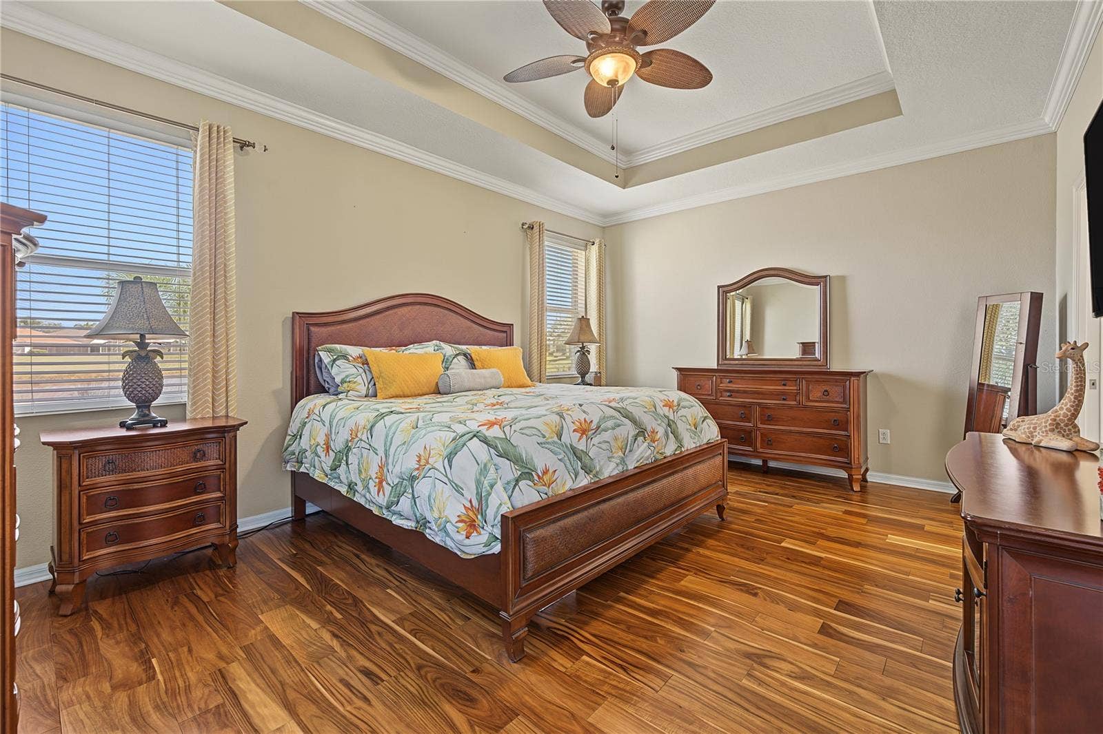 29145 GRASS BUNKER DRIVE, San Antonio, FL 33576 Primary bedroom with tray ceiling, wood floors and stunning views