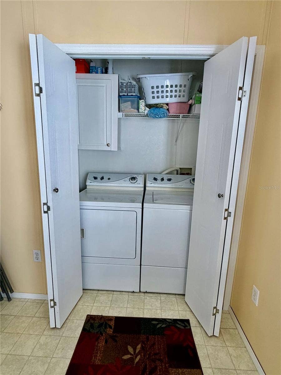 34012 AZALEA DRIVE N, Pinellas Park, FL 33781 Indoor Laundry room at the back of the kitchen