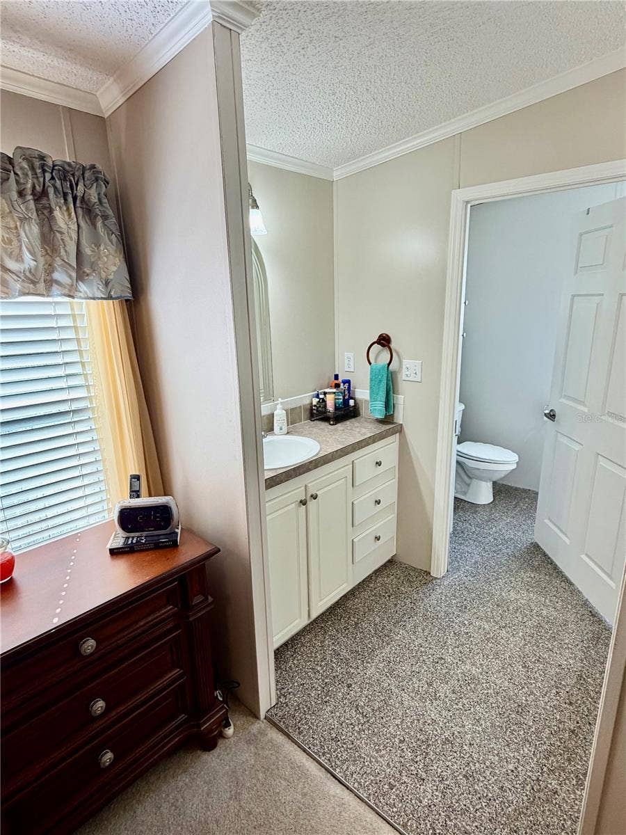 34012 AZALEA DRIVE N, Pinellas Park, FL 33781 Primary Bathroom suite, features double sinks and walk in shower