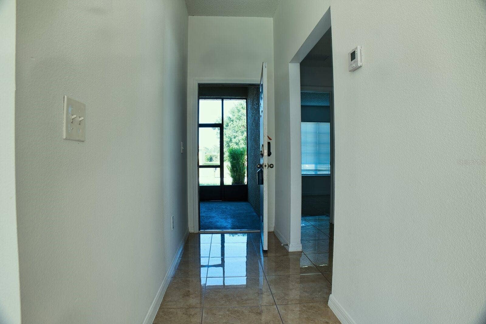 11007 WHITECAP DRIVE, Riverview, FL 33579 Inviting entrance hallway featuring a bright and welcoming transition into the home.