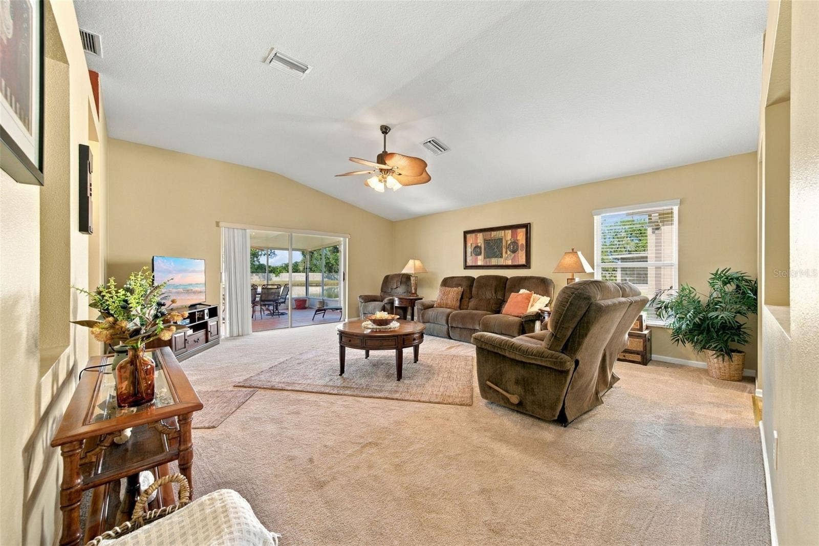 5936 WAR ADMIRAL DRIVE, Wesley Chapel, FL 33544 Family Room overlooking lanai and pond