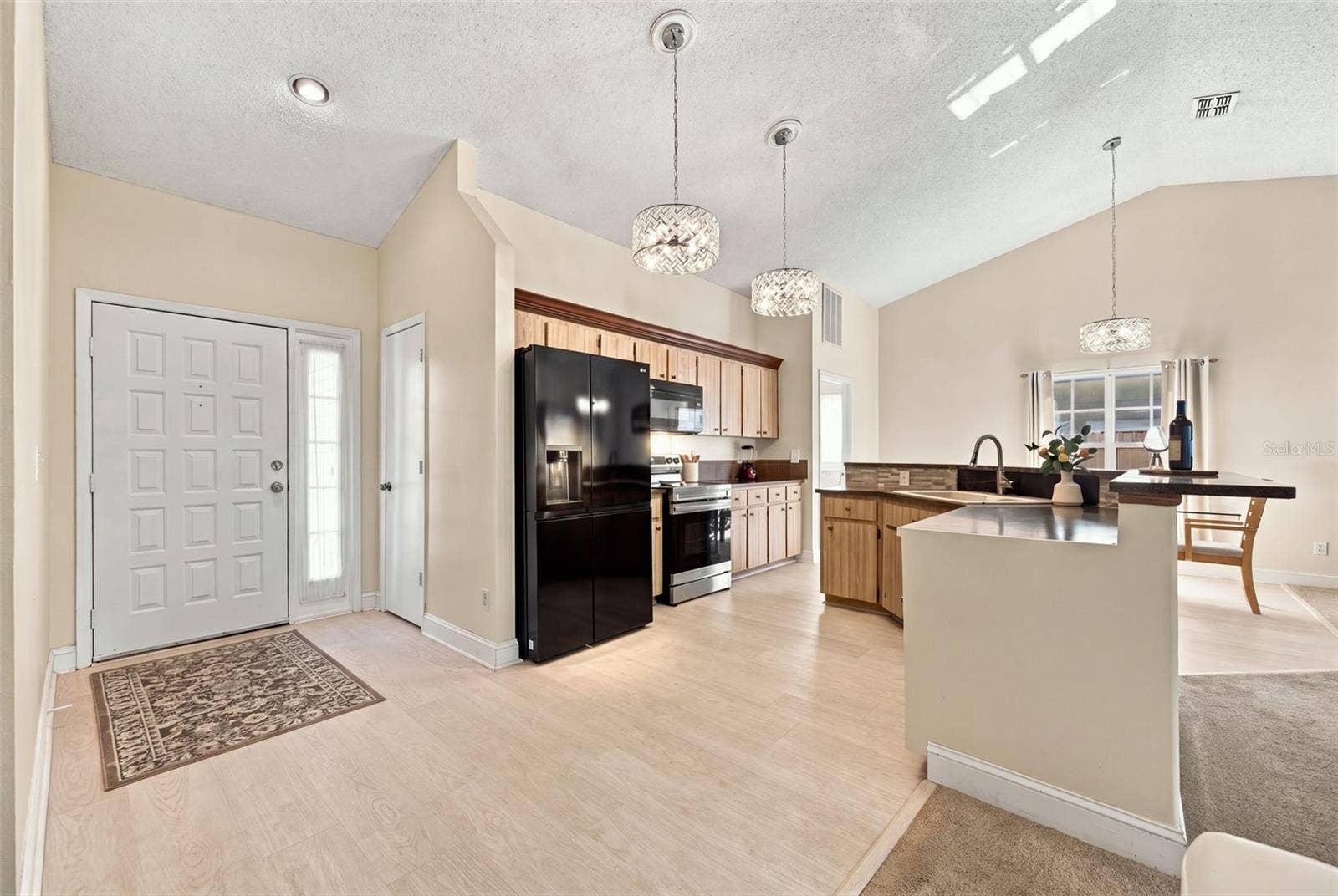 1509 RIDGE SHORE DRIVE, Tarpon Springs, FL 34689 foyer leading into kitchen