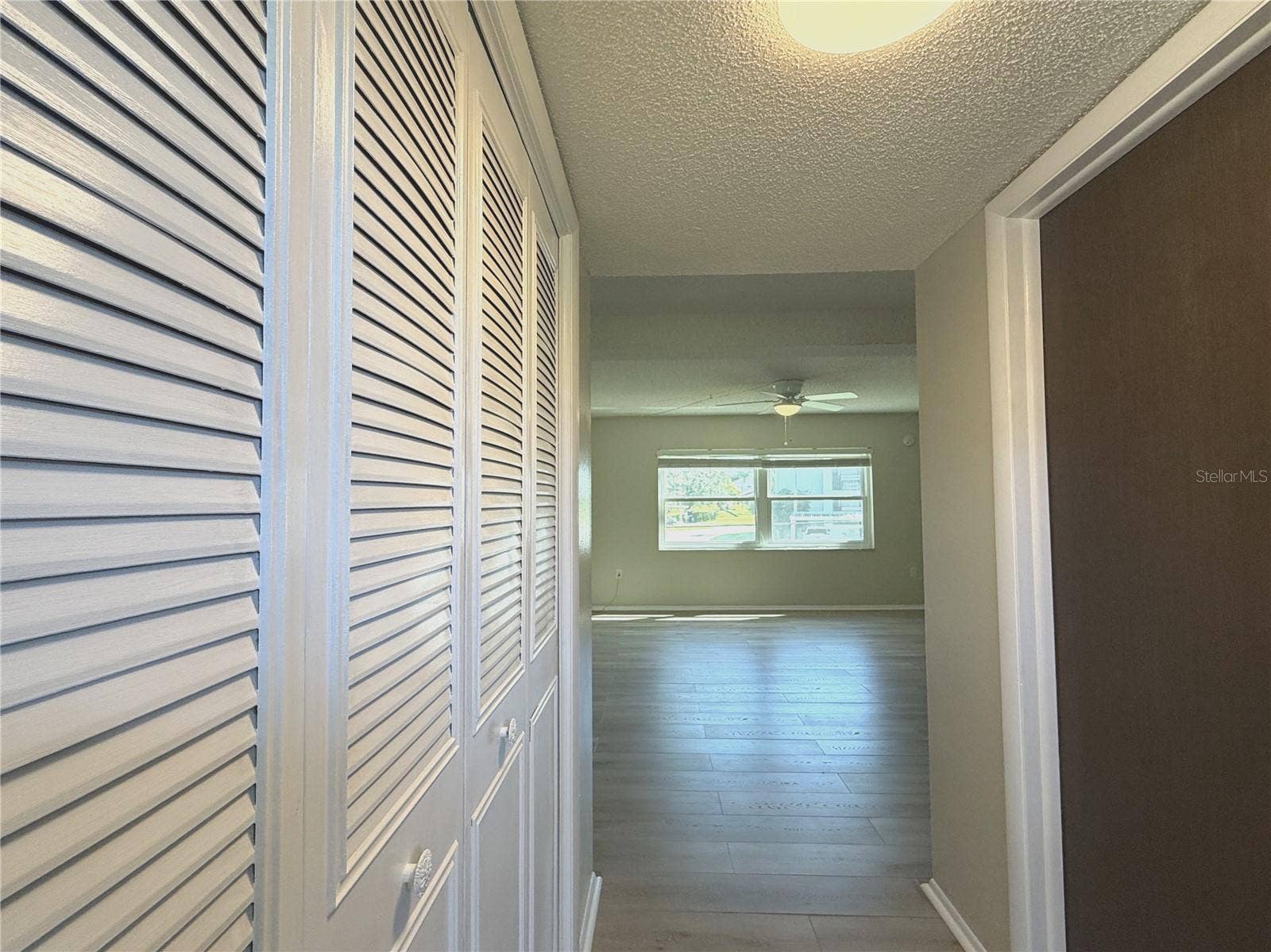 1127 KING ARTHUR COURT, #309, Dunedin, FL 34698 Front Entry - Entry Closet