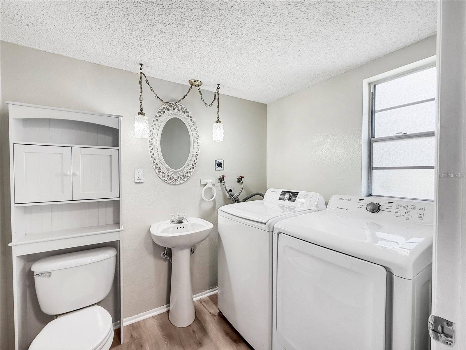1127 KING ARTHUR COURT, #309, Dunedin, FL 34698 Half Bath and Laundry 1st Floor