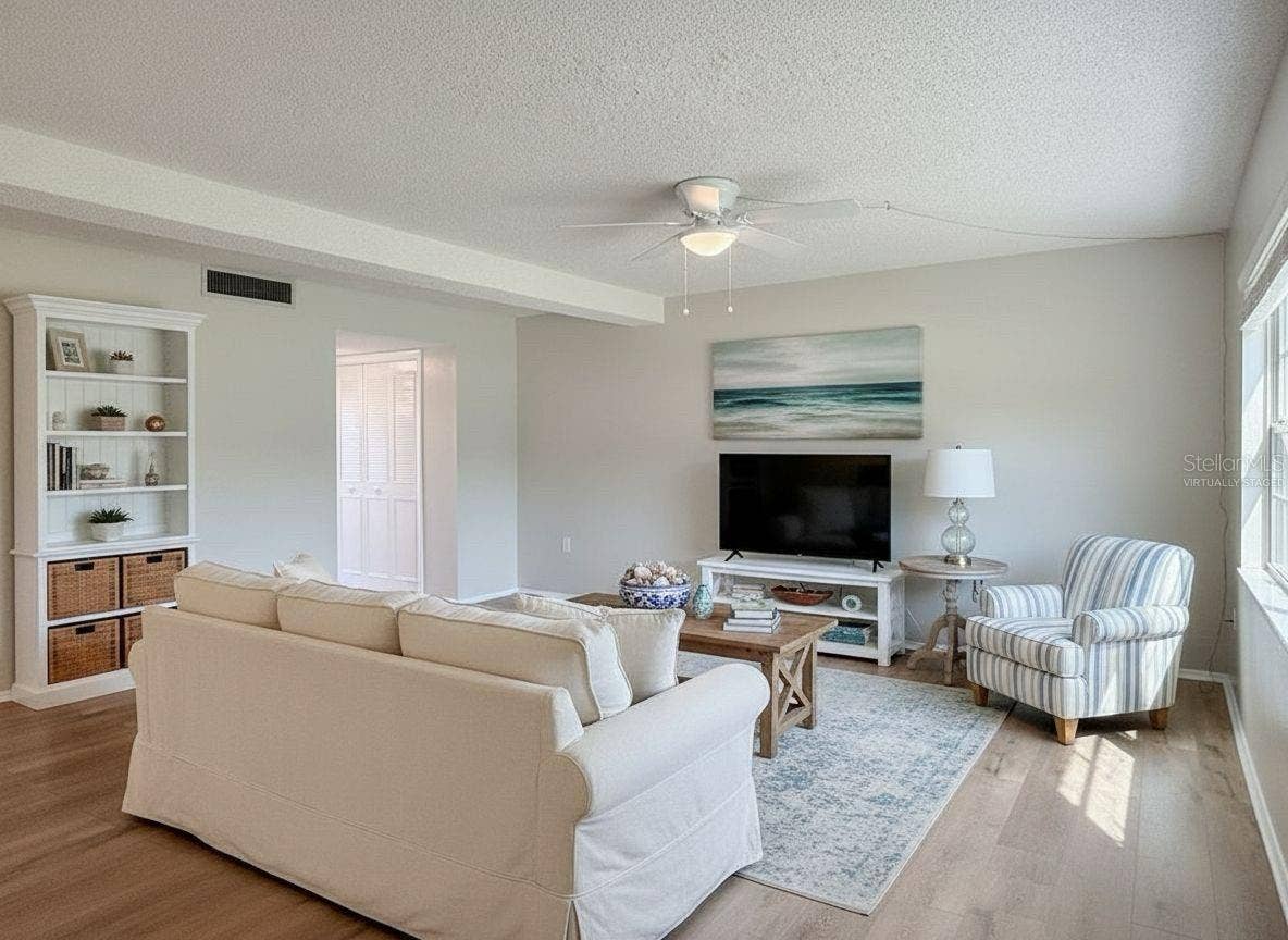 1127 KING ARTHUR COURT, #309, Dunedin, FL 34698 Great Room - Virtually Staged