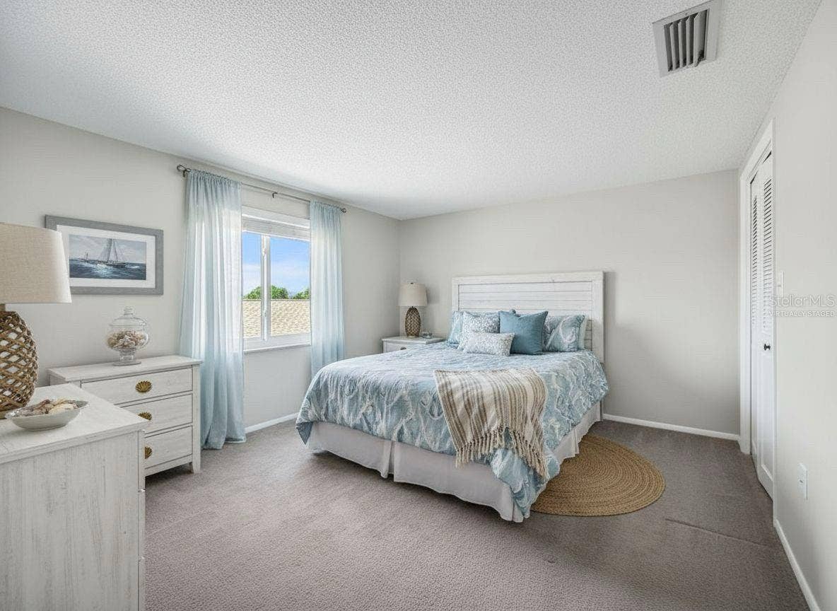 1127 KING ARTHUR COURT, #309, Dunedin, FL 34698 Front Bedroom - Virtually Staged