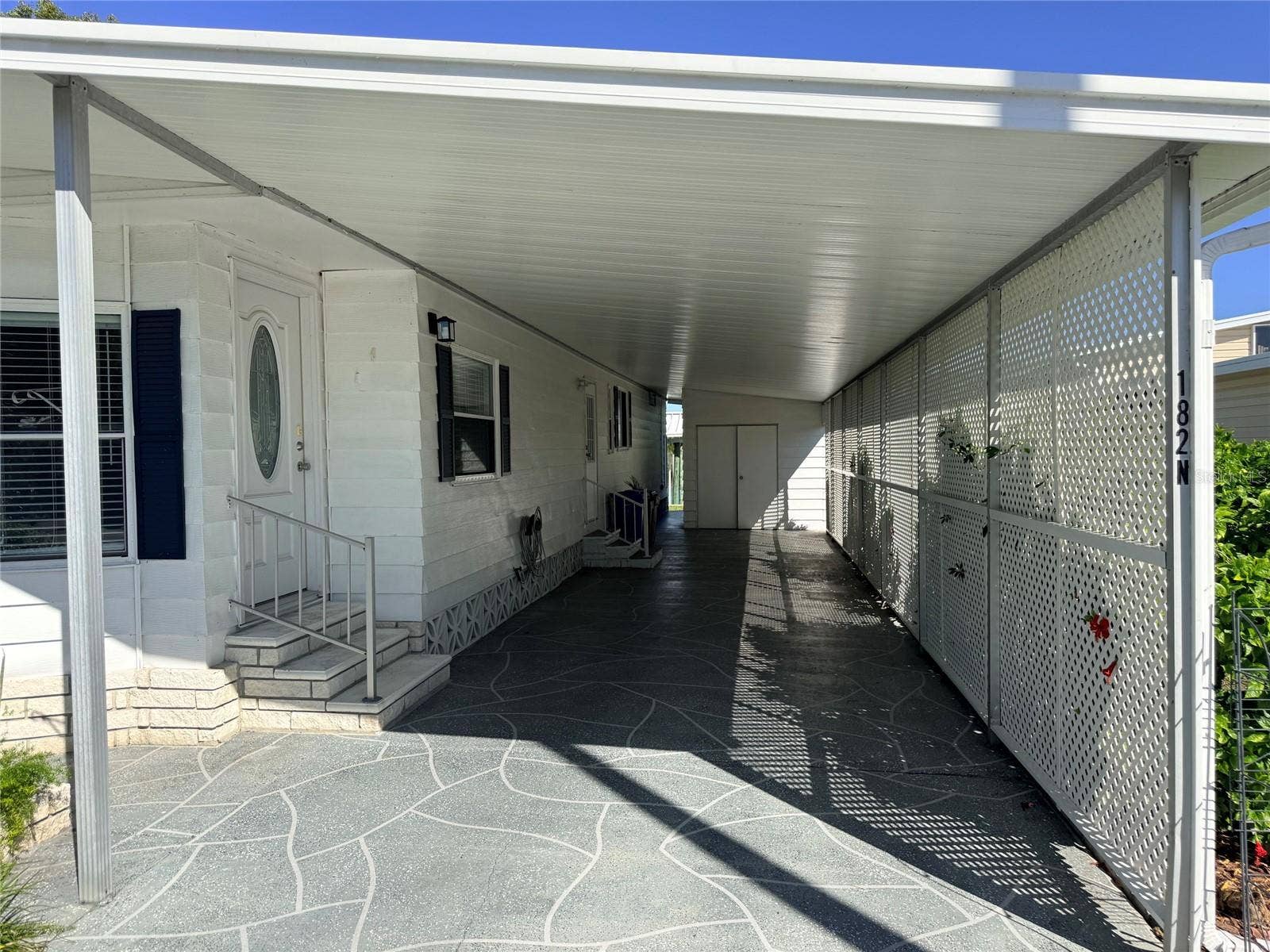 182 N SAINT THOMAS CIRCLE, Apollo Beach, FL 33572 Exterior Right Carport & Entry