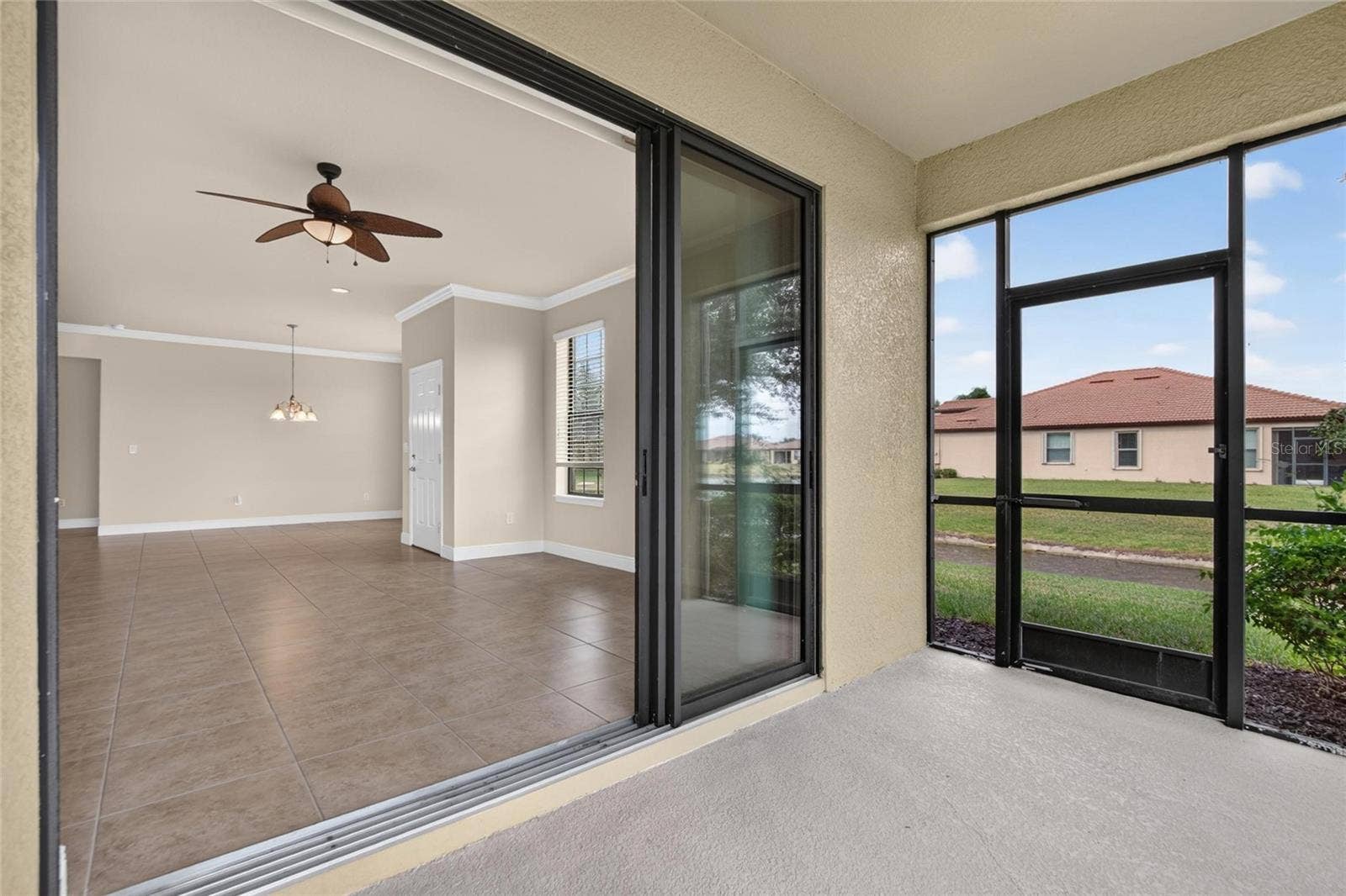 5504 SUNSET FALLS DRIVE, Apollo Beach, FL 33572 Lanai and Living room and dining room