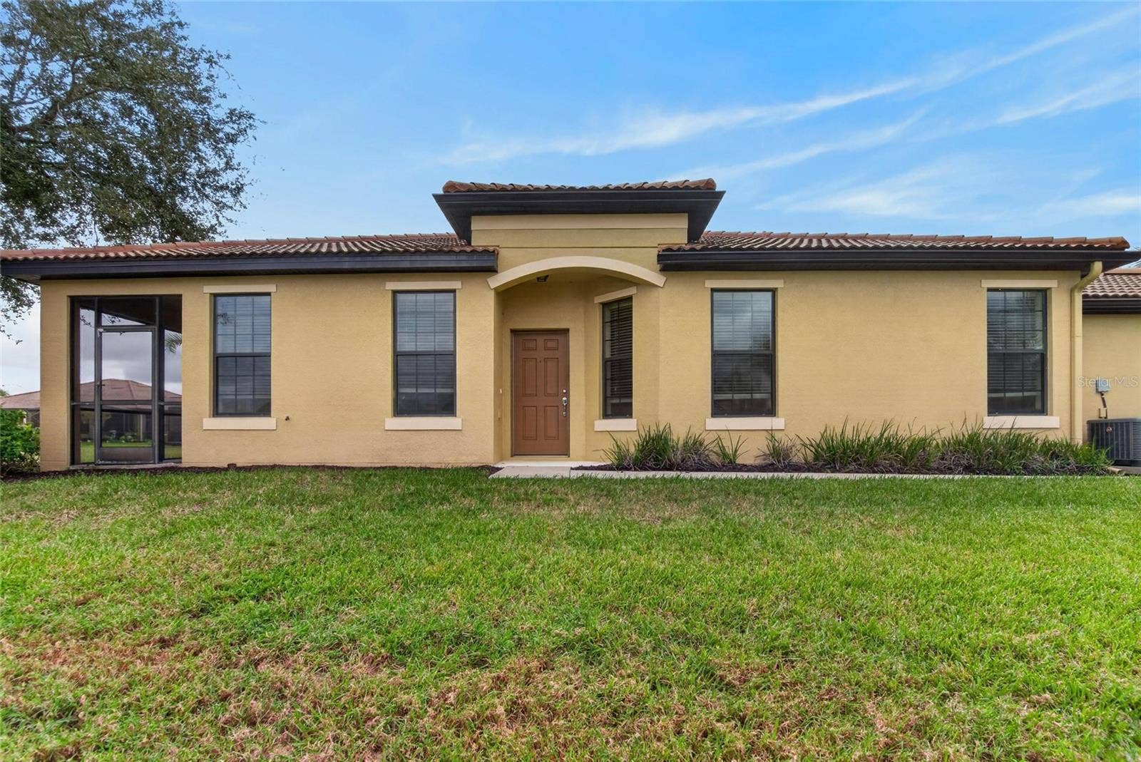 5504 SUNSET FALLS DRIVE, Apollo Beach, FL 33572 Side entrance to villa