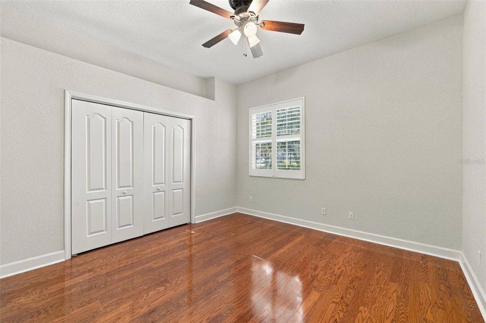 3916 VALRICO GROVE DRIVE, Valrico, FL 33594 Bedroom 2 with Real Wood Floors, 5 1/4 Baseboards, Plantation Shutters and the Interior was just painted!