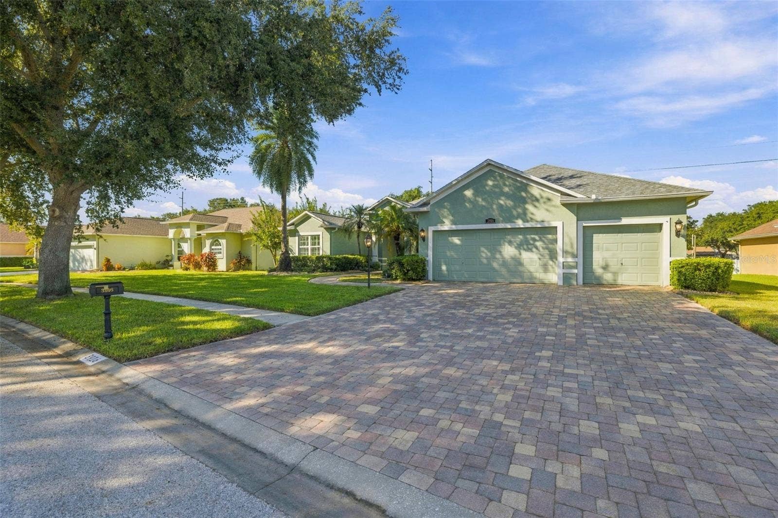 3916 VALRICO GROVE DRIVE, Valrico, FL 33594 Entry Sidewalk & Driveway all in Pavers to marvel at your home!
