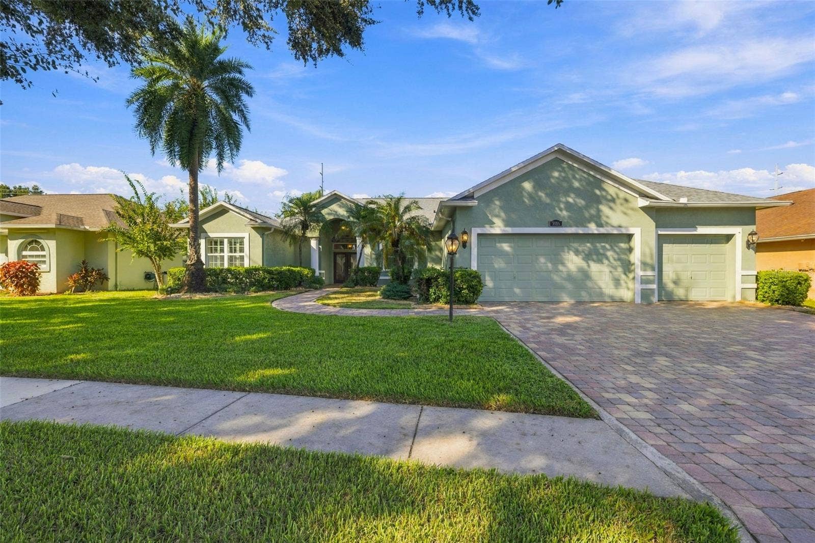 3916 VALRICO GROVE DRIVE, Valrico, FL 33594 3 Car Garage is a special feature that is situated well on this almost 1/4 Acre Lot!