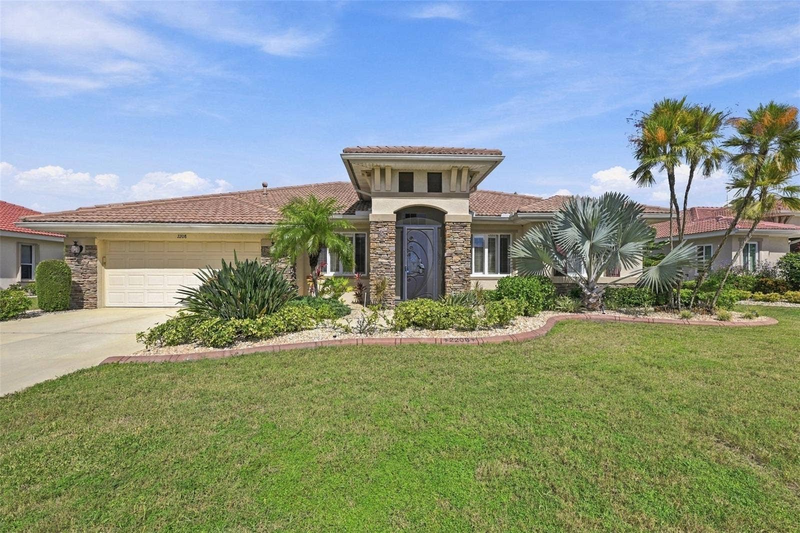 Beautiful slate rock detailing and architectural details define this home.