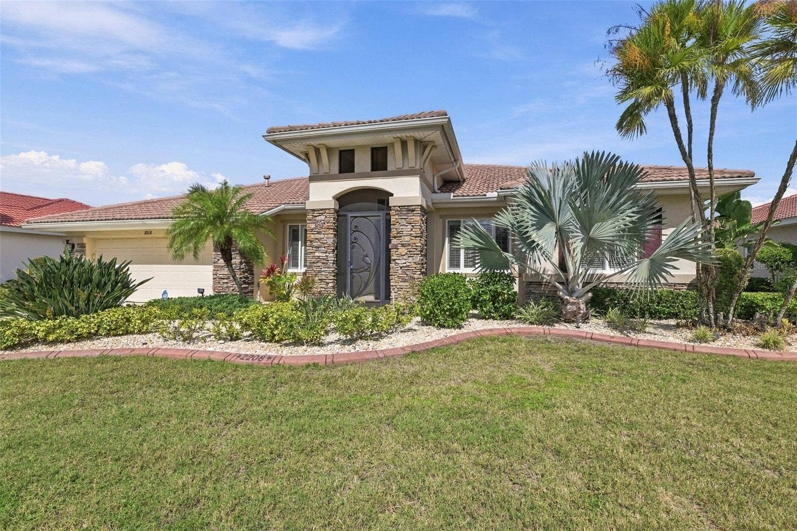 Custom landscape curbing and xeriscape plants give this home beautiful landscaping with minimal maintenance.