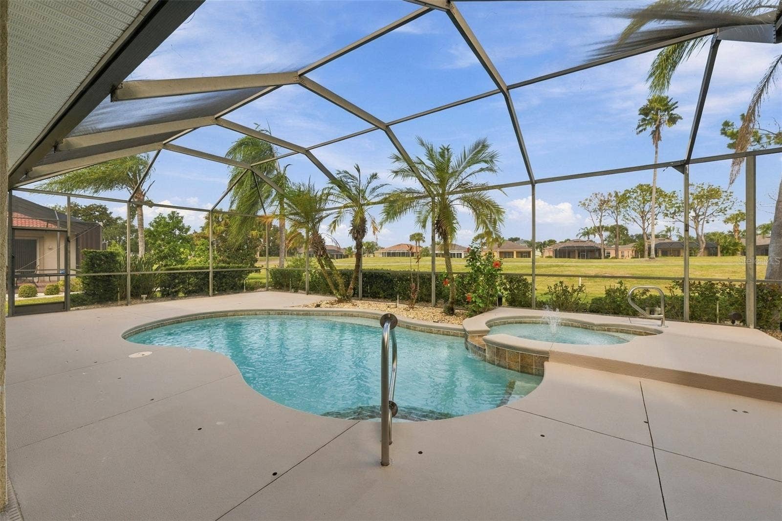 Beautiful pool area with the child proof security screen and holes ready for any young visitors.