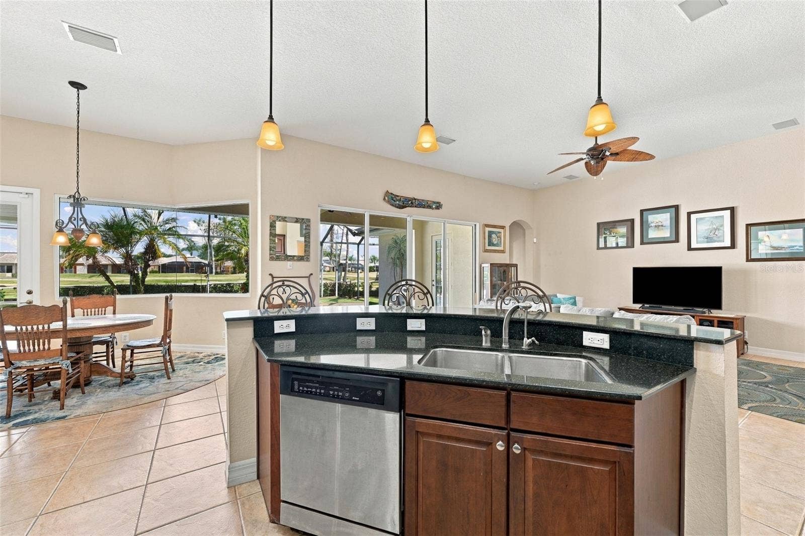 Open to the entire living area and the outside pool area, you are always in the action.  With both a breakfast bar and dinette, you have plenty of room for guests and diversity.
