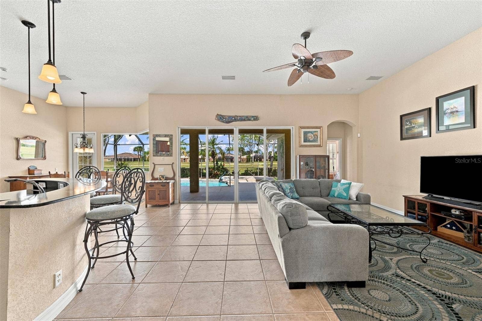As you walk into the main living area, what a VIEW! A wall of glass to ultimately enjoy all that this offers, high ceilings, an open floor plan and lots of space to enjoy entertaining.