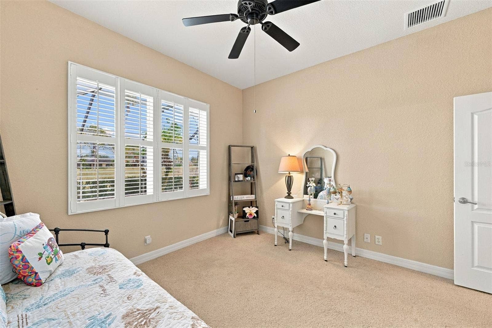 This room offers a spectacular view of the pool area and golf course.