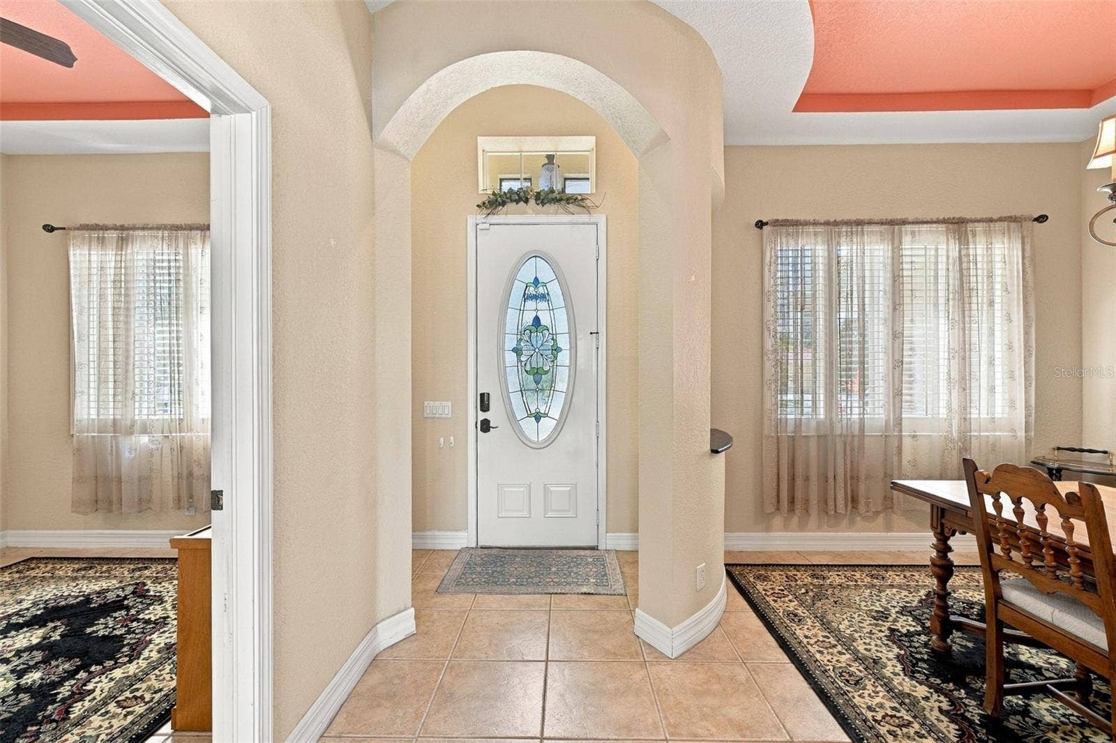 A unique feature is the curved entranceway that welcomes guests.  This opens up the dining room to the right and the office to the left.