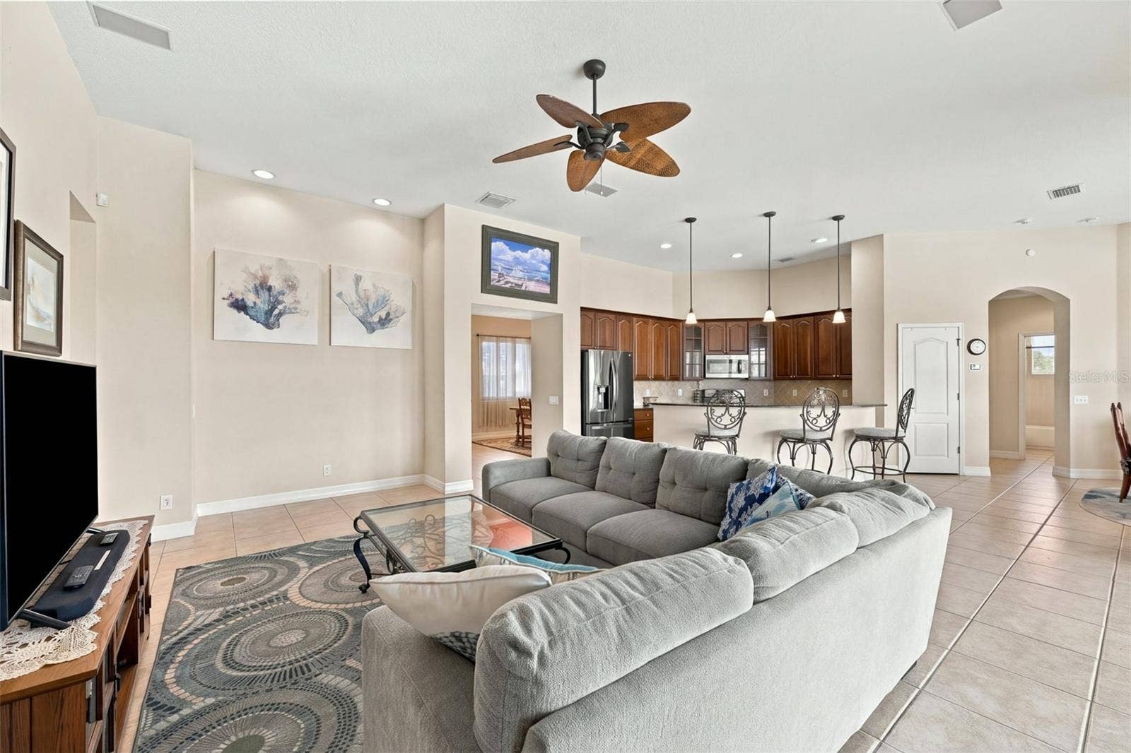 Tile floors, recessed lighting and architectural insets define this home as an example of quiet elegance.
