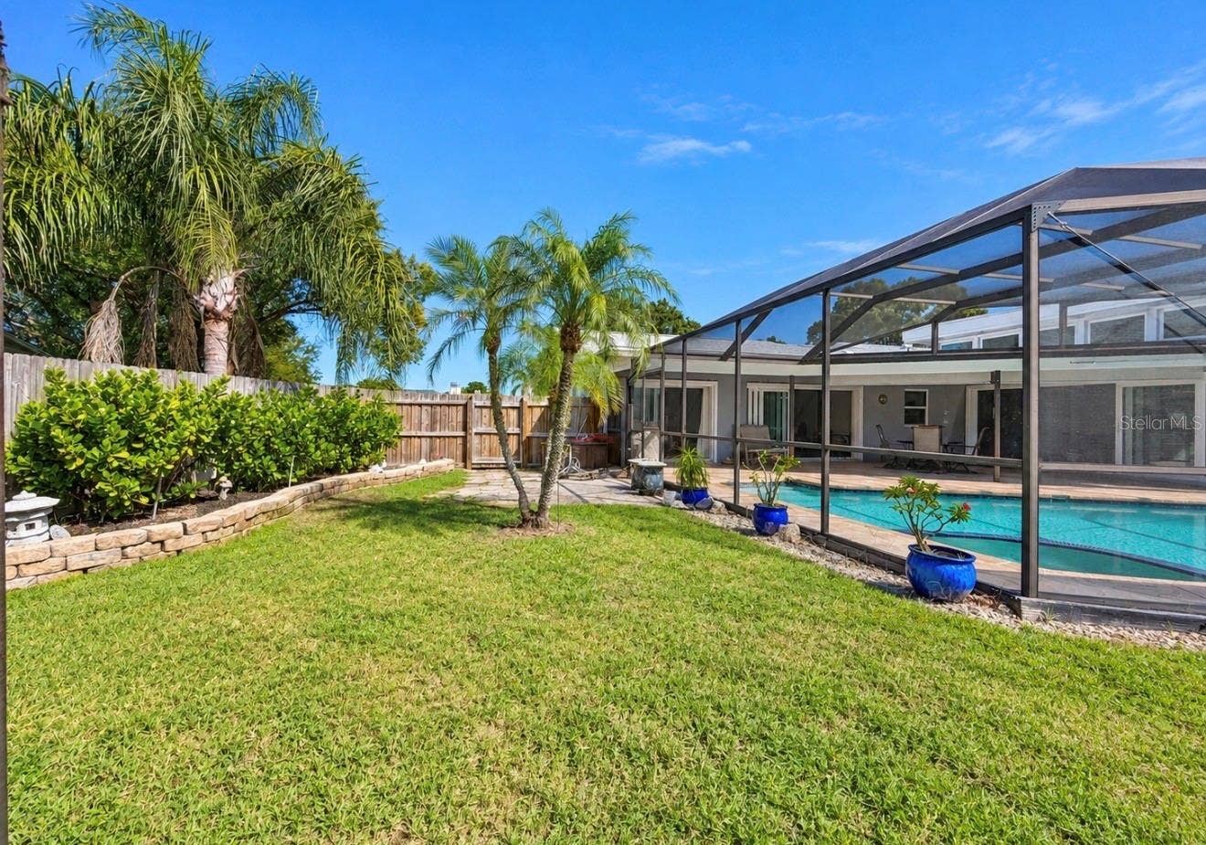 9690 LEEWARD AVENUE, Largo, FL 33773 Yard with pool enclosure