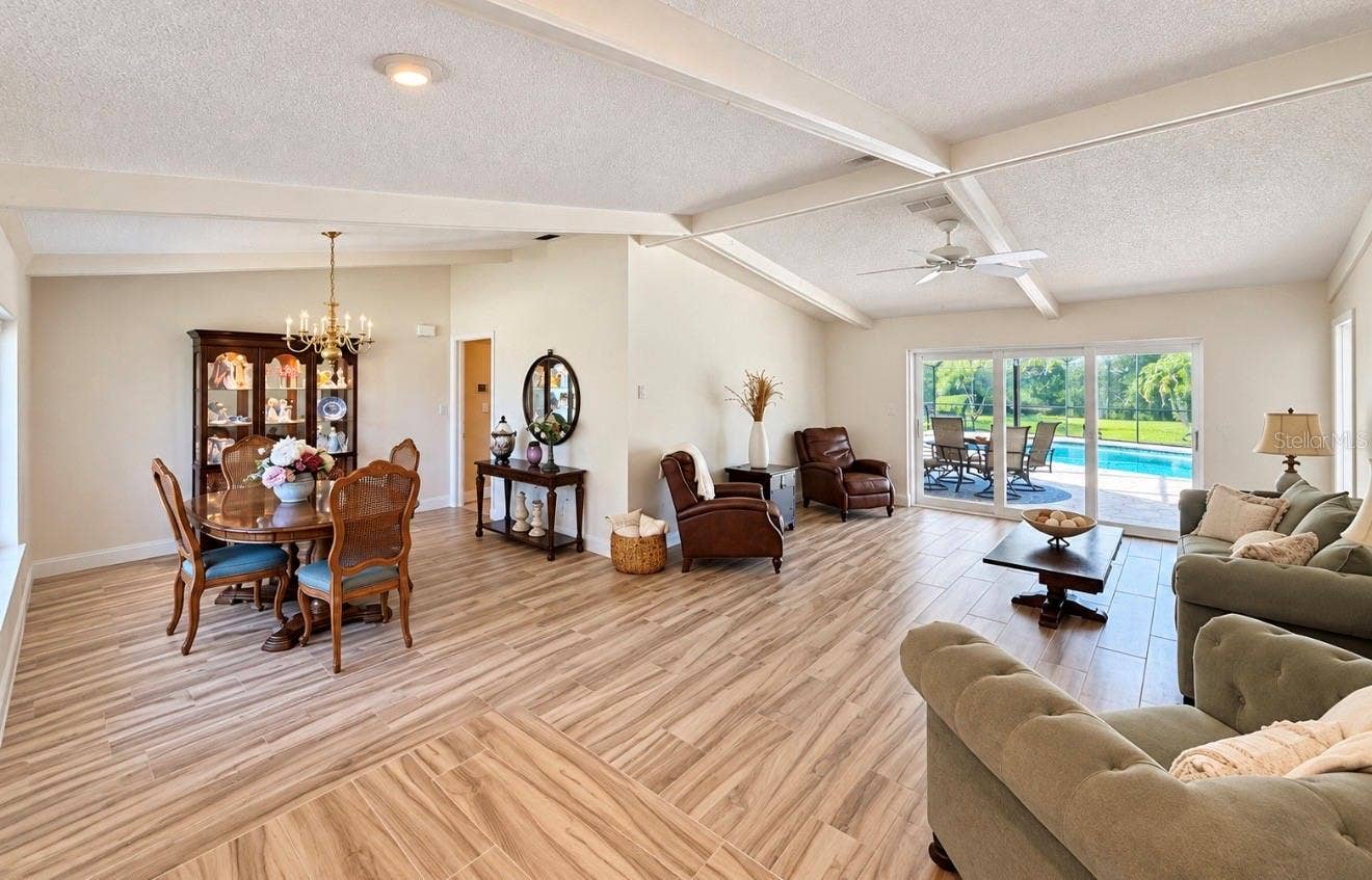 9690 LEEWARD AVENUE, Largo, FL 33773 Front living room with cathedral ceilings