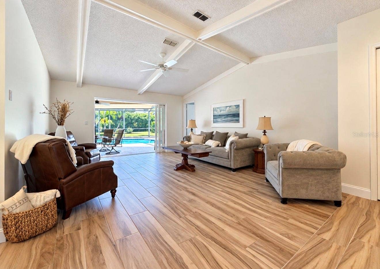 9690 LEEWARD AVENUE, Largo, FL 33773 Living room to pool lanai