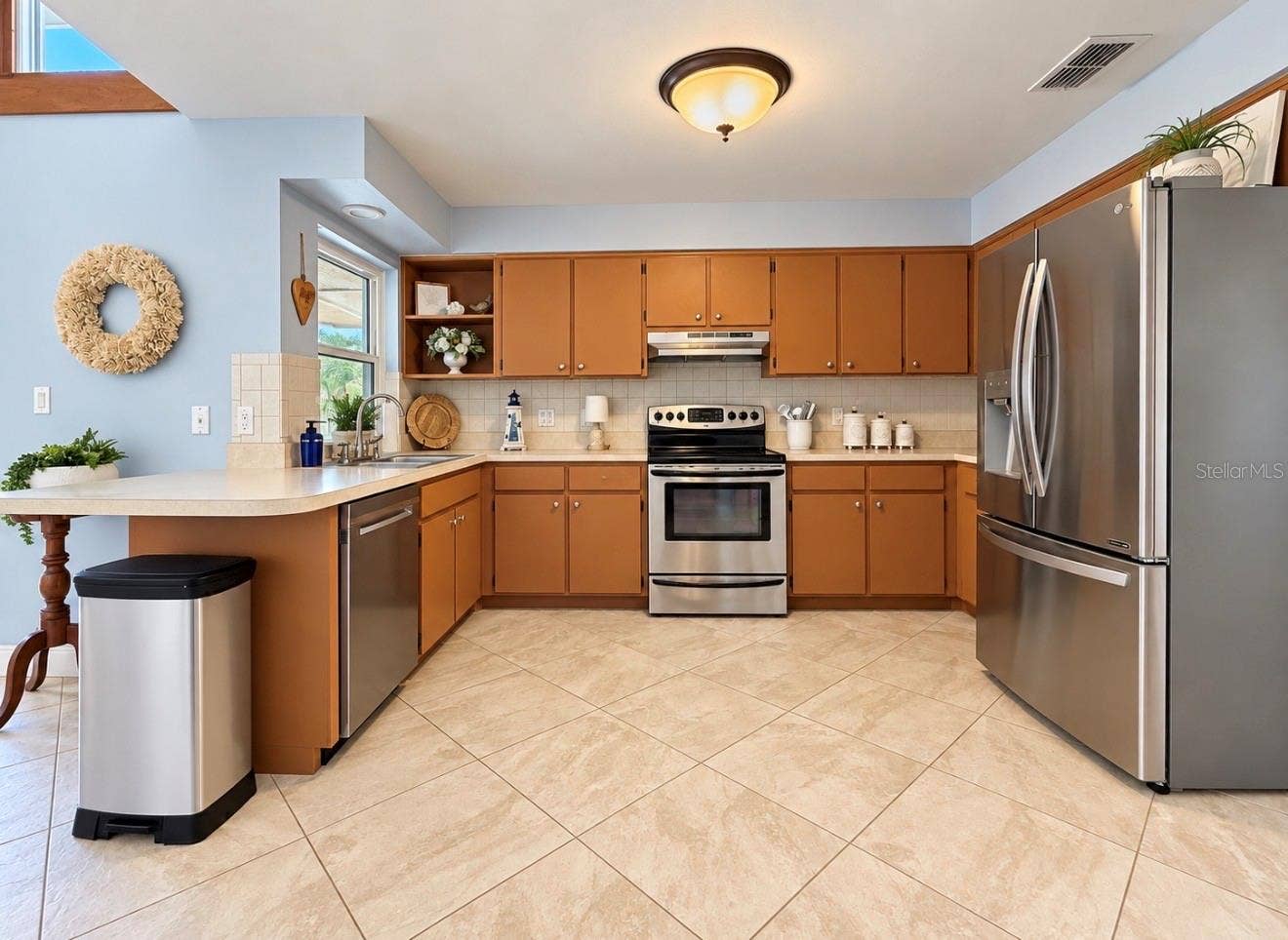 9690 LEEWARD AVENUE, Largo, FL 33773 Kitchen with stainless steel appliances