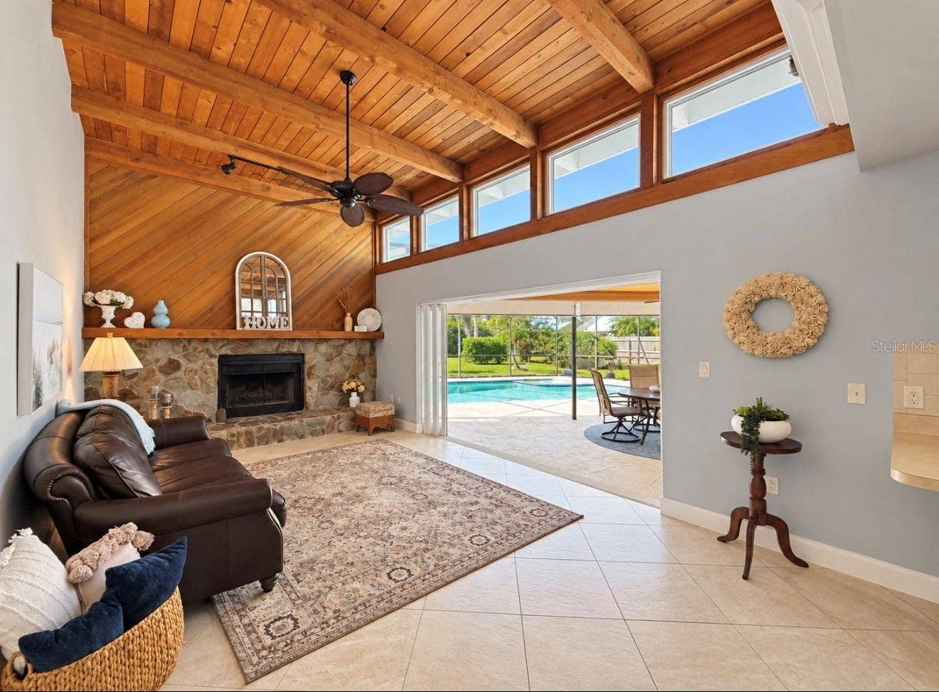 9690 LEEWARD AVENUE, Largo, FL 33773 Family room looking out over pool lanai