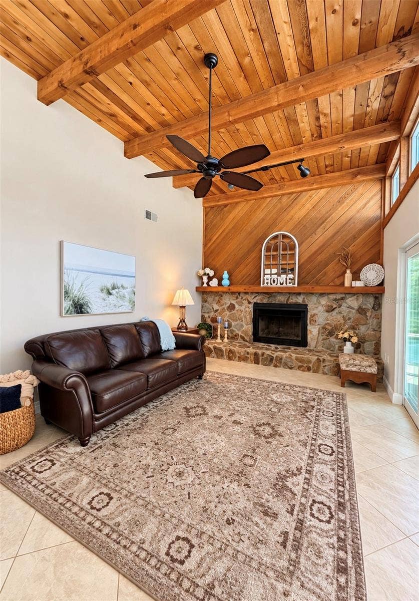 9690 LEEWARD AVENUE, Largo, FL 33773 Family room with natural light and fireplace
