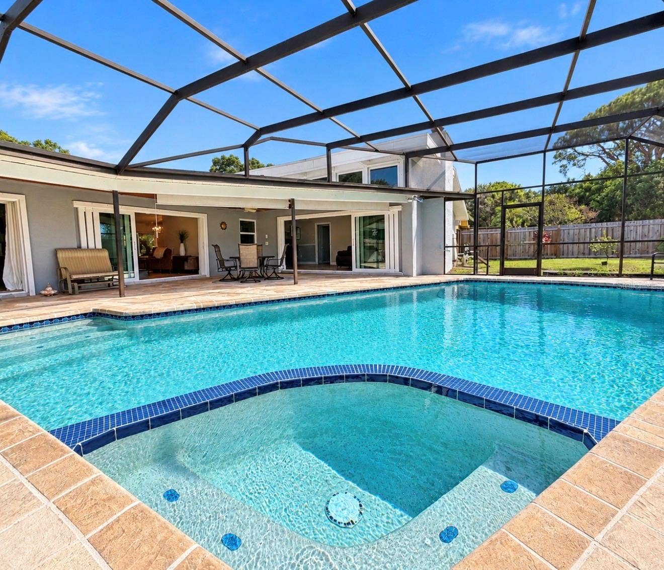 9690 LEEWARD AVENUE, Largo, FL 33773 Screened Enclosed pool with spillover spa