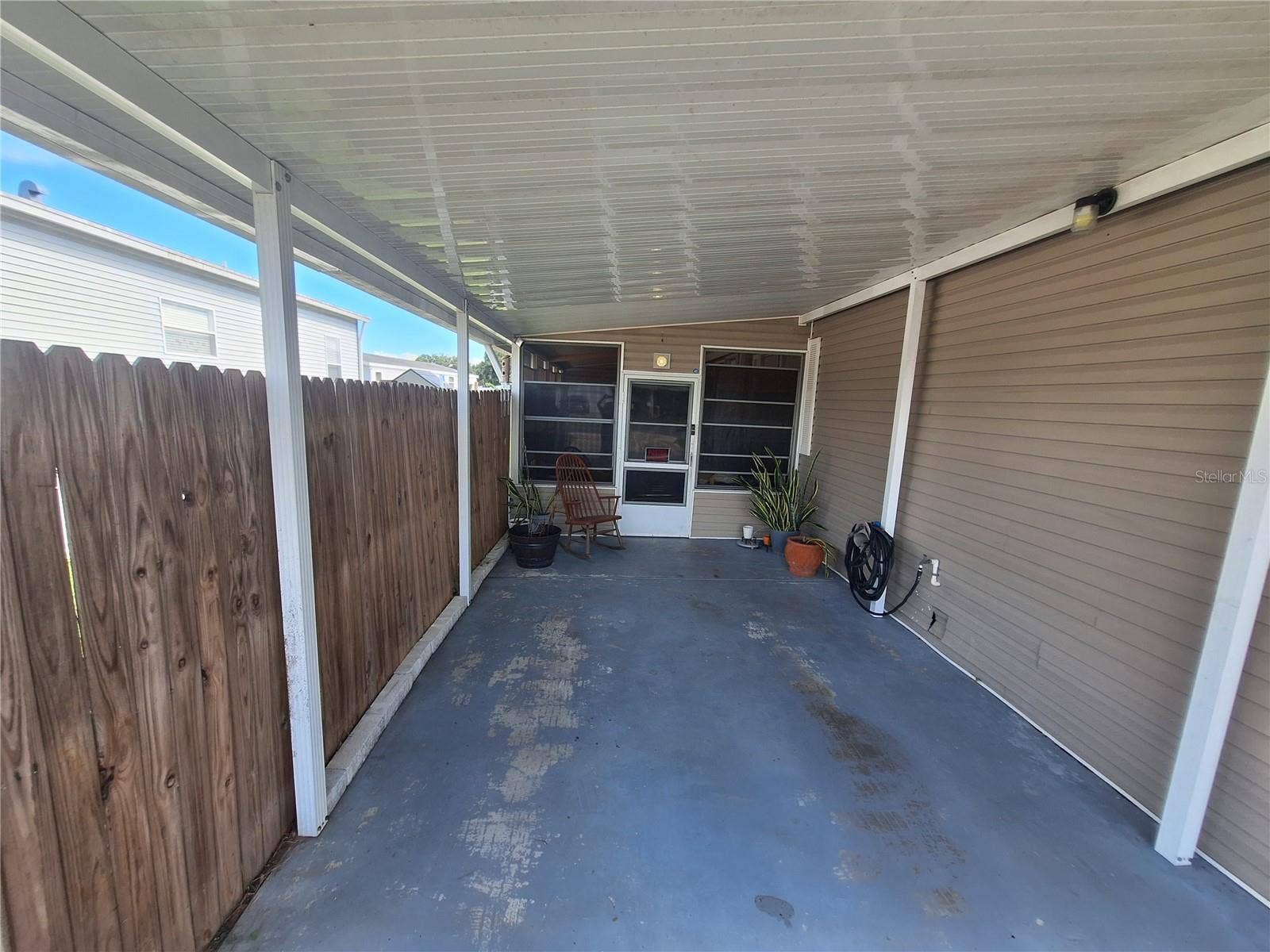 37650 NEWPORT DRIVE, Zephyrhills, FL 33542 Carport provides a great place to park enabling you to stay out of the Florida weather.