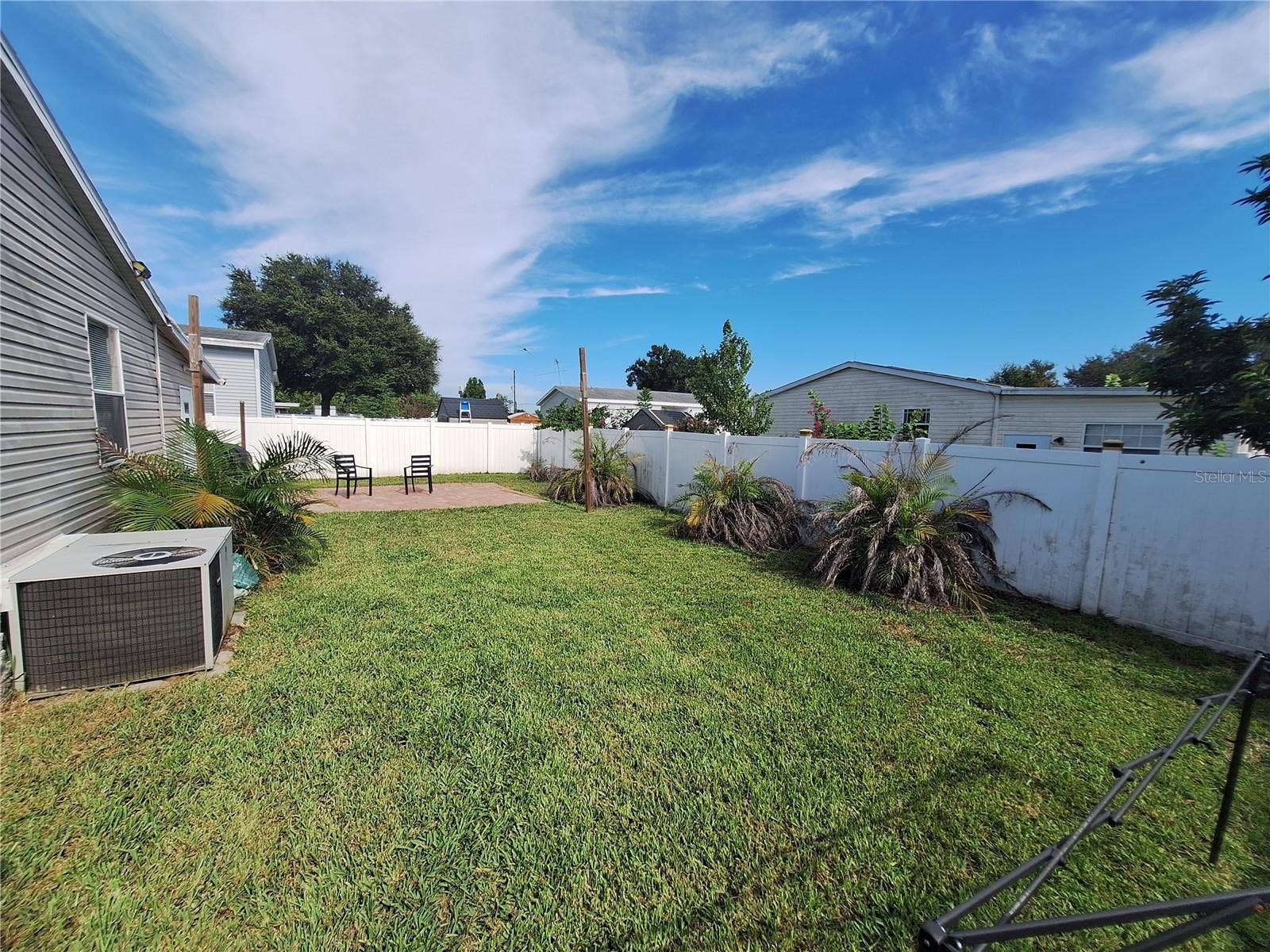 37650 NEWPORT DRIVE, Zephyrhills, FL 33542 Fenced, landscaped backyard.