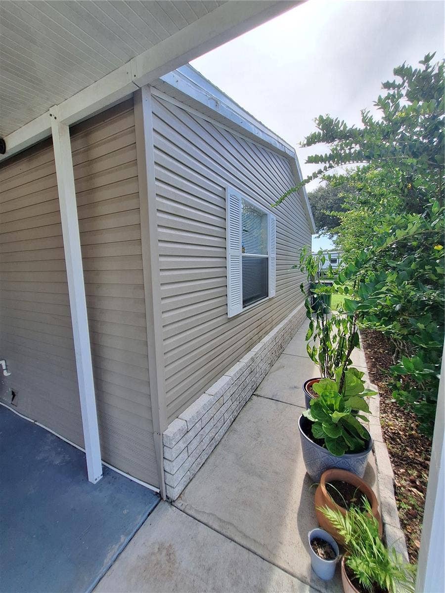 37650 NEWPORT DRIVE, Zephyrhills, FL 33542 Front walkway can be made even more inviting with additional plants for outside decoration.