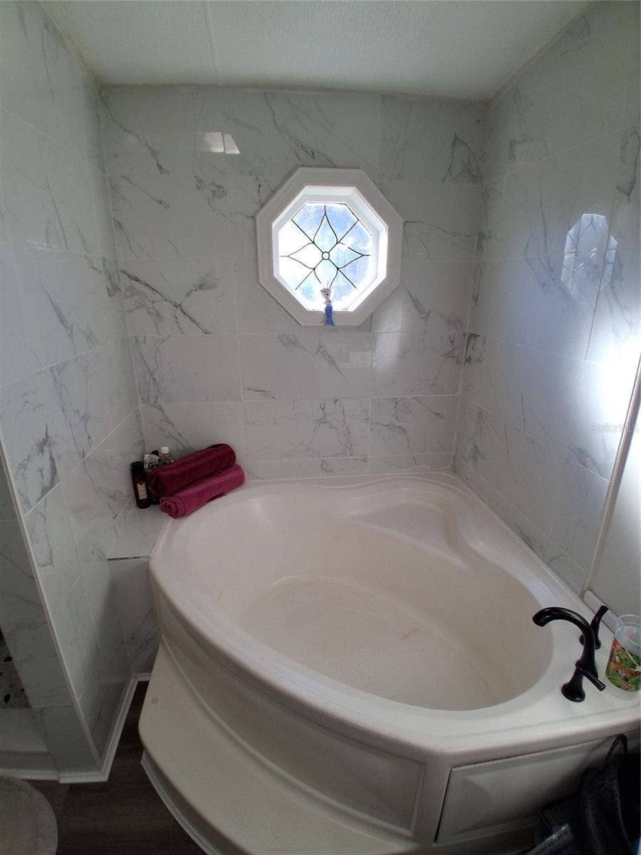 37650 NEWPORT DRIVE, Zephyrhills, FL 33542 Primary private bath includes a soaker tub to soak the day away! New faucet gives it a special look.