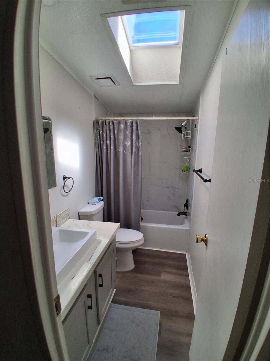 37650 NEWPORT DRIVE, Zephyrhills, FL 33542 The guest bath has a newly installed skylight allowing for natural light.