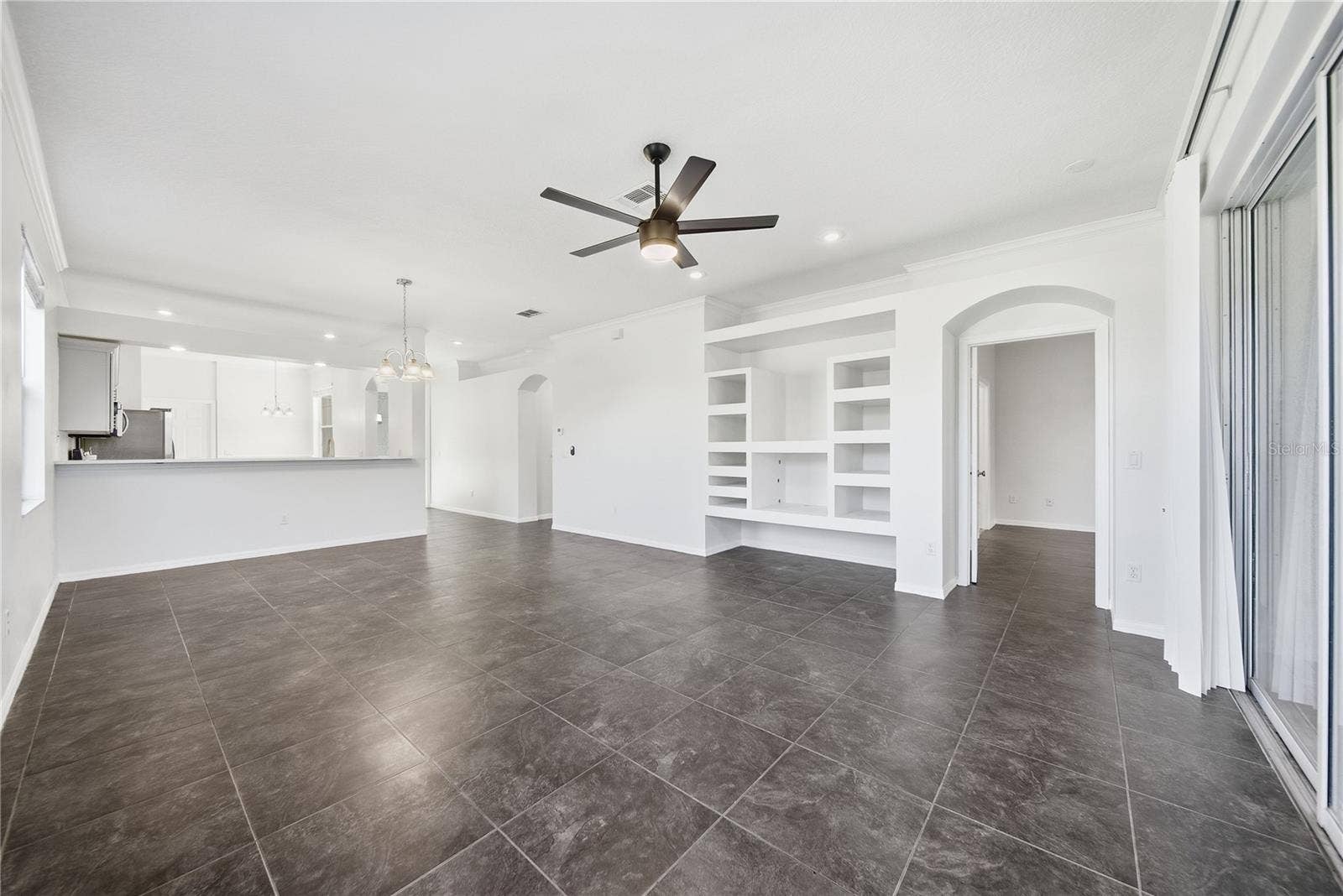 Bright and airy living room with built in shelves