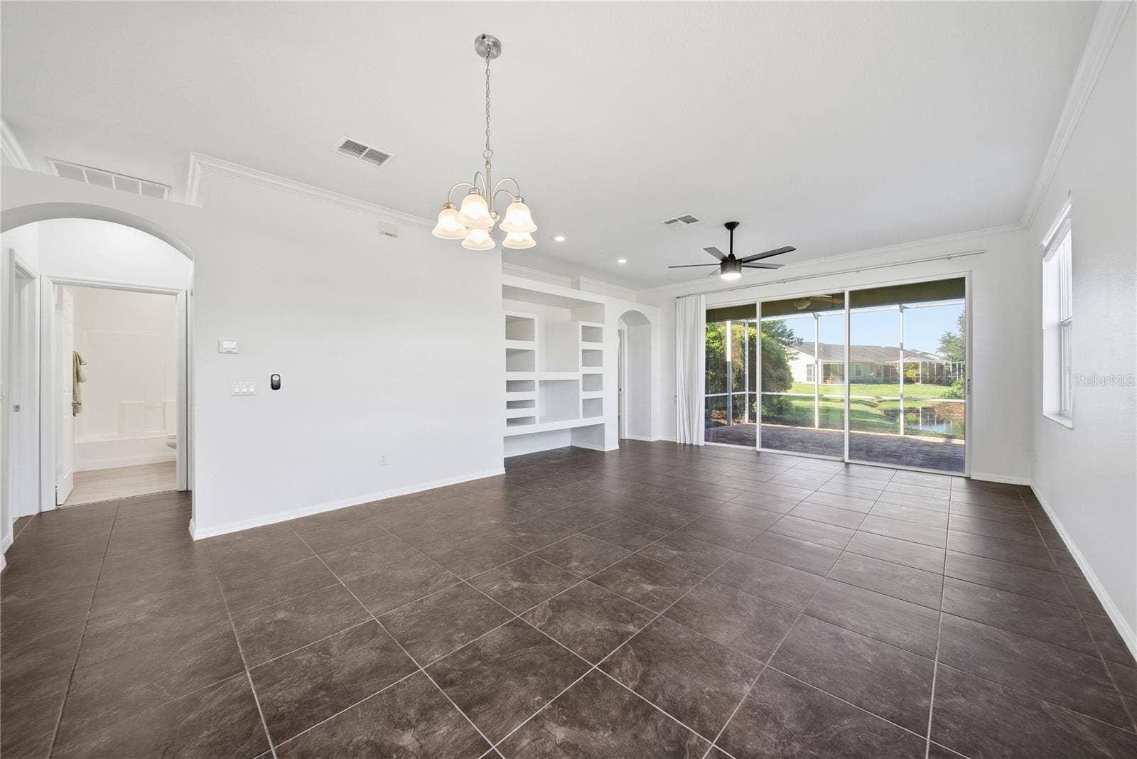 Your view out into your lanai with preserve and a small stream running through in back.