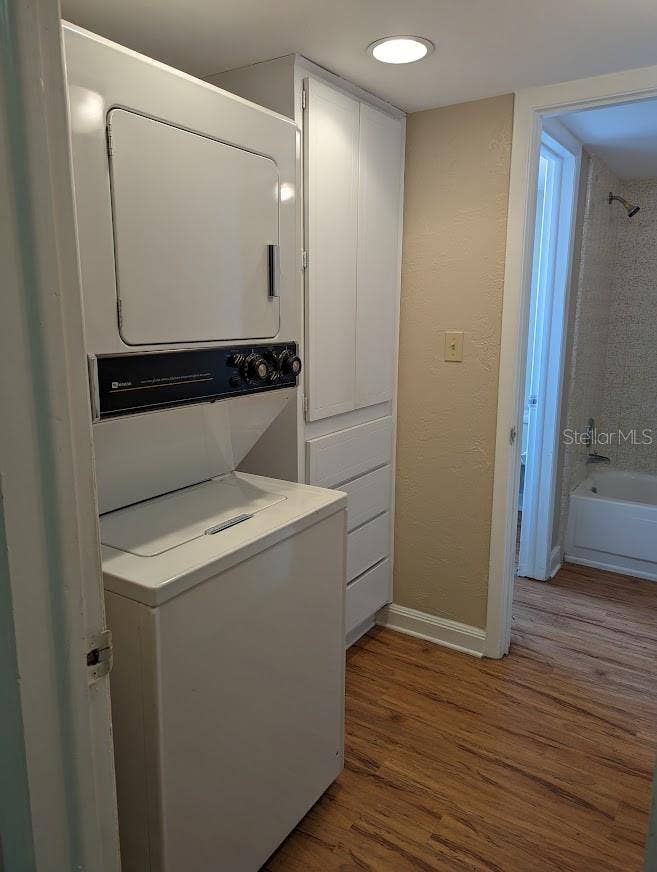 Laundry space with bult in storage connects to bath and to kitchen