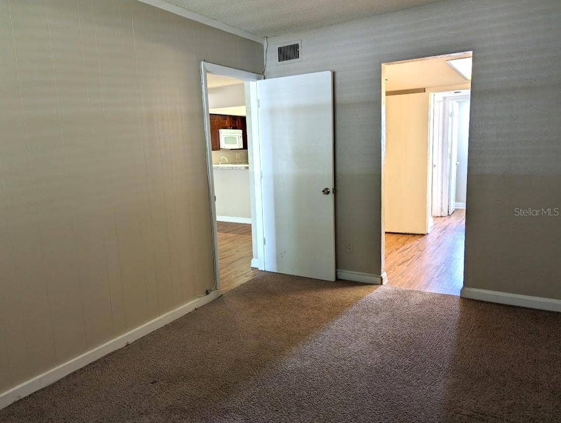 Bedroom with doors to living room and en suite bathroom