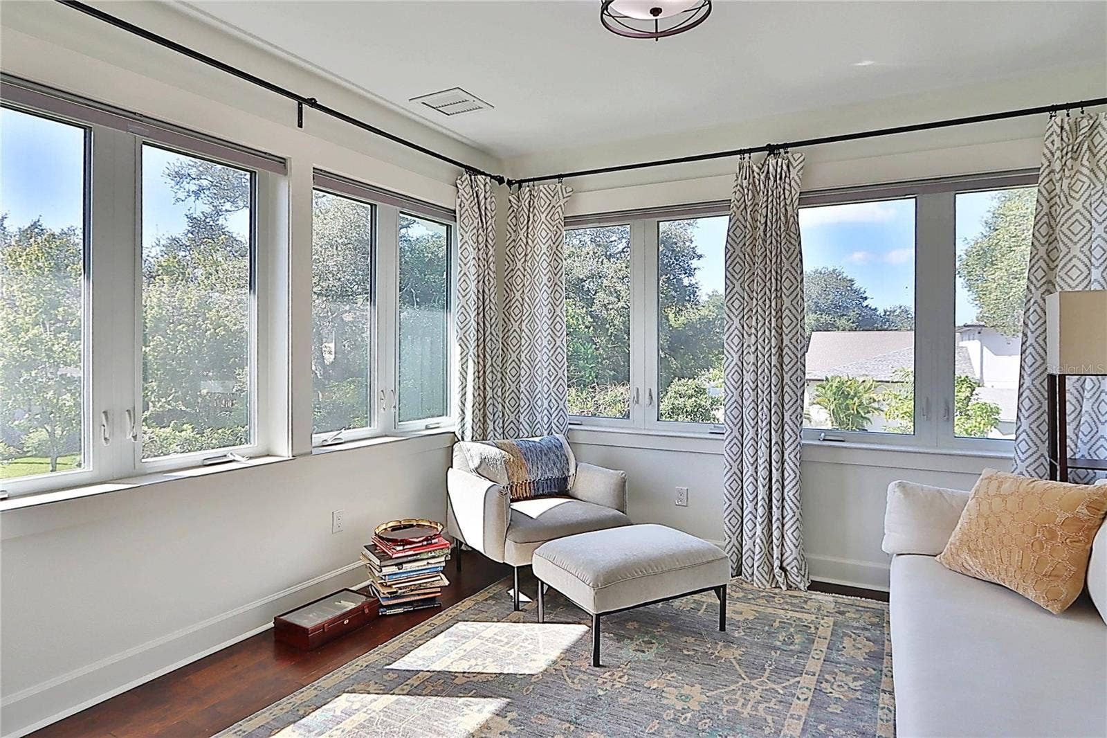 natural light  abounds in the sitting area of primary suite