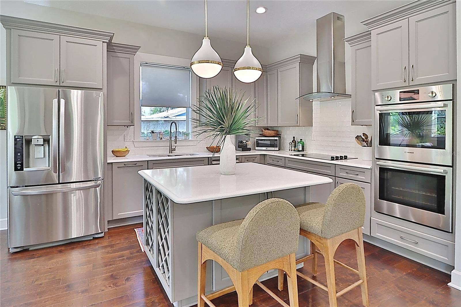 chefs kitchen with large pantry- center island with wine storage