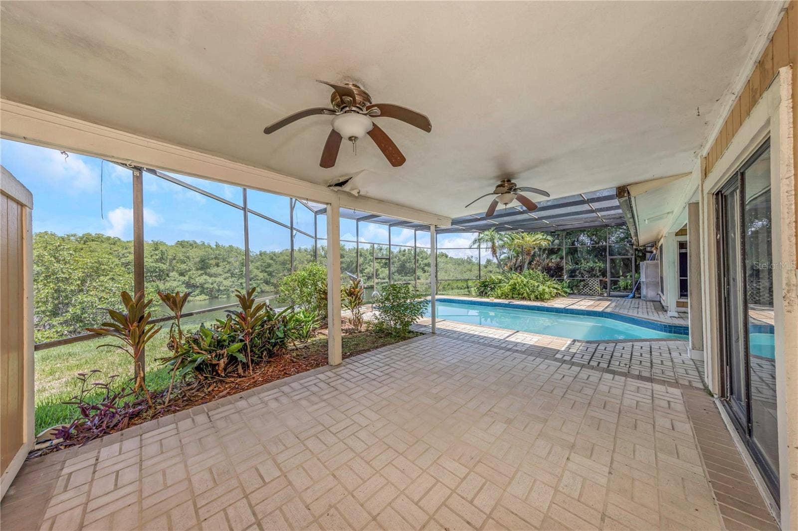 7448 17TH LANE NE, St Petersburg, FL 33702 Rear Patio - Reverse View