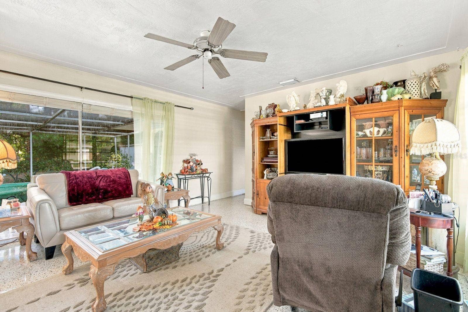 6801 17TH LANE N, St Petersburg, FL 33702 Family room with ample natural light with pool view