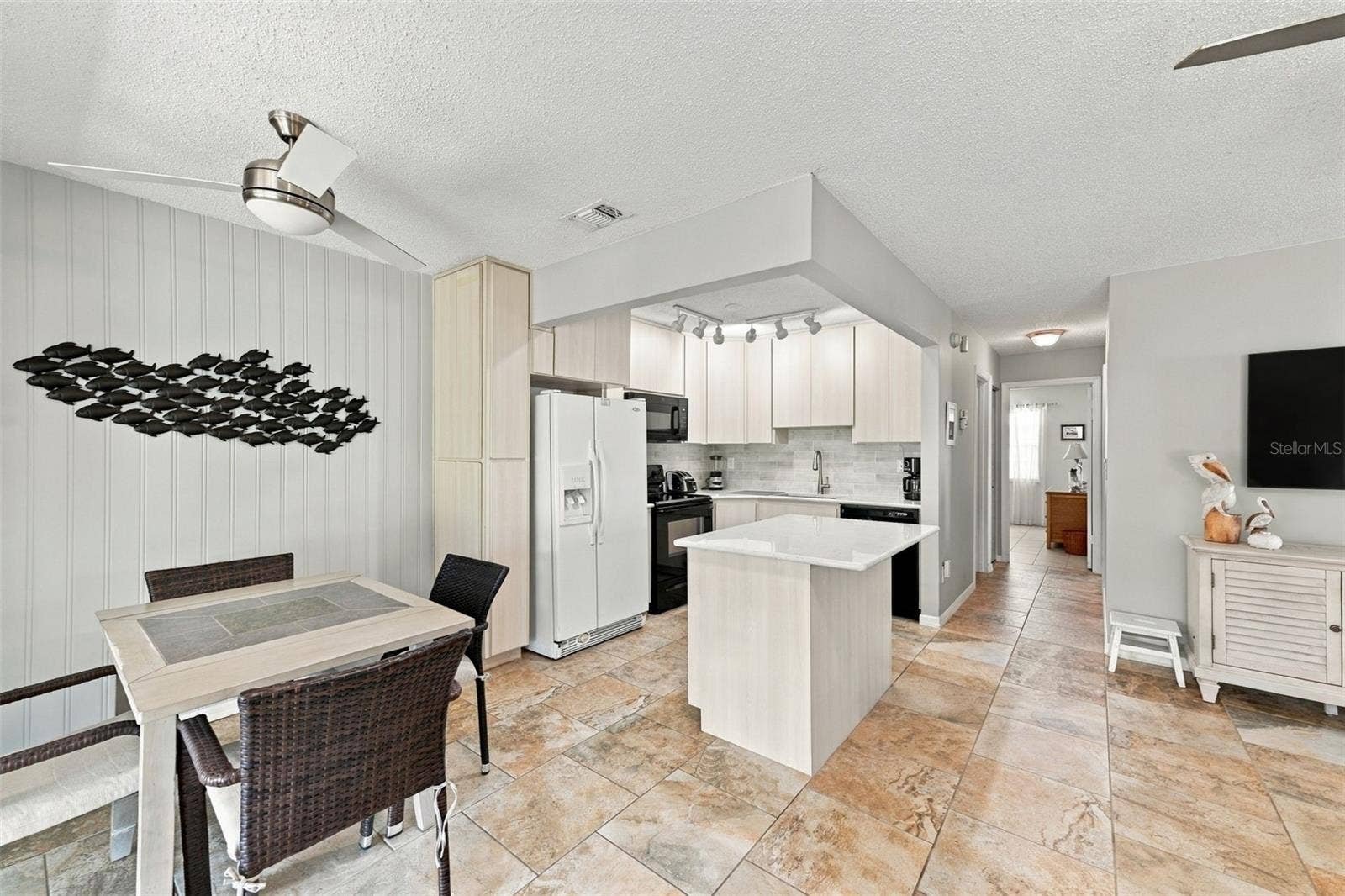 1905 CANTERBURY LANE, #8, Sun City Center, FL 33573 Dining Room into the Kitchen