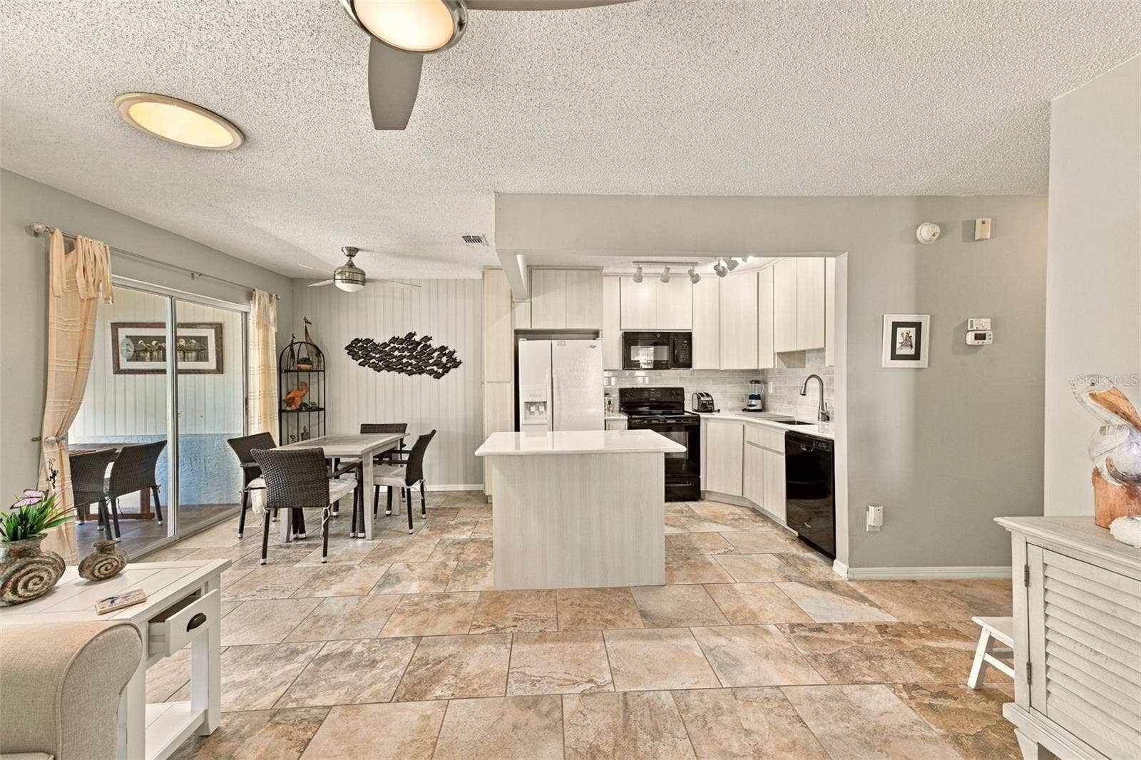 1905 CANTERBURY LANE, #8, Sun City Center, FL 33573 Looking into kitchen and Dining From the Living Room