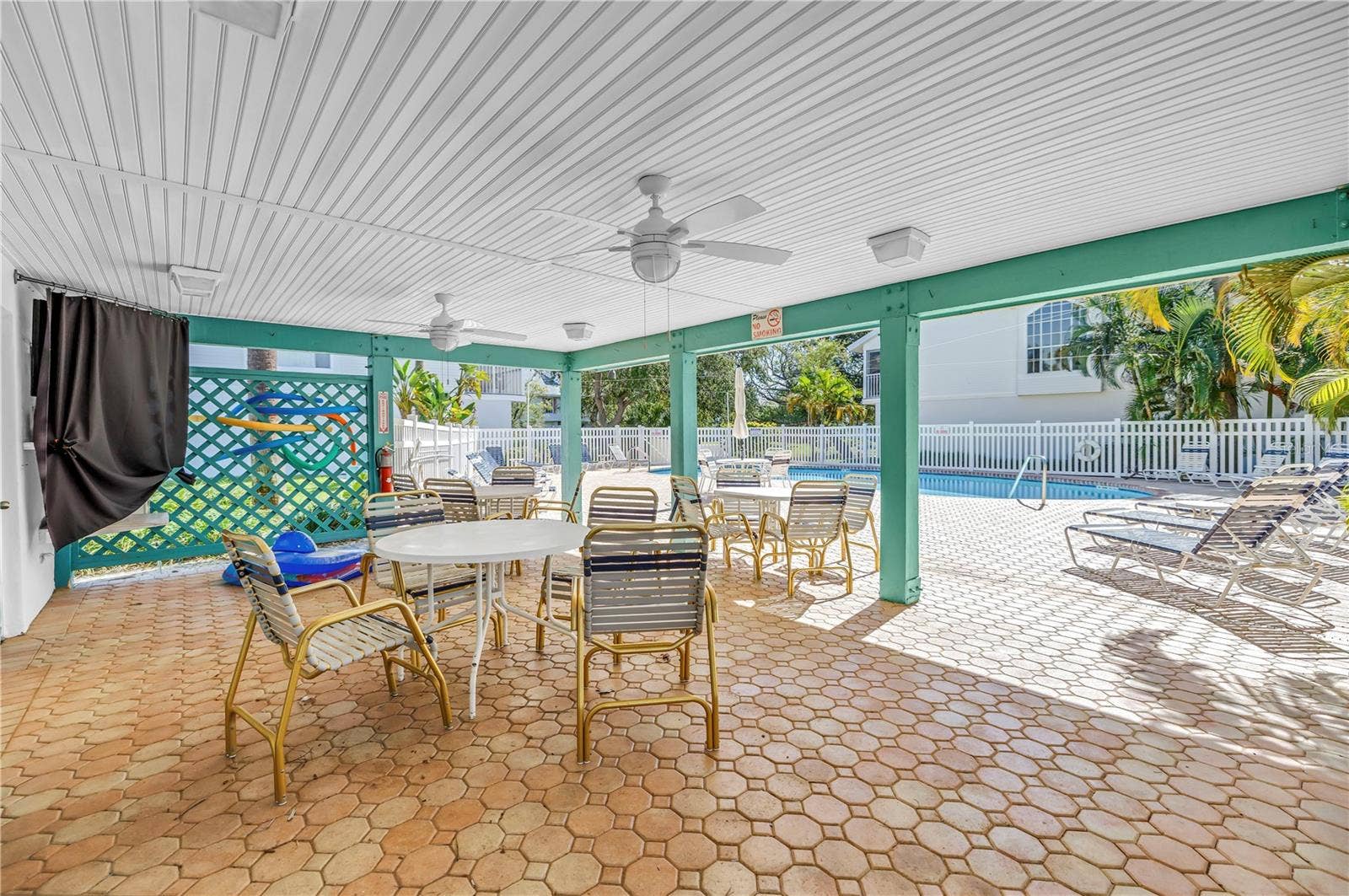 159 SUN ISLE CIR, Treasure Island, FL 33706 Community pool with covered seating area