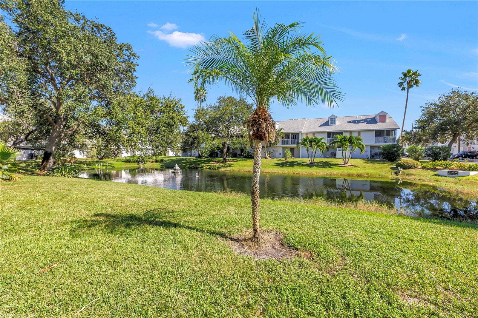 159 SUN ISLE CIR, Treasure Island, FL 33706 Lake view from unit